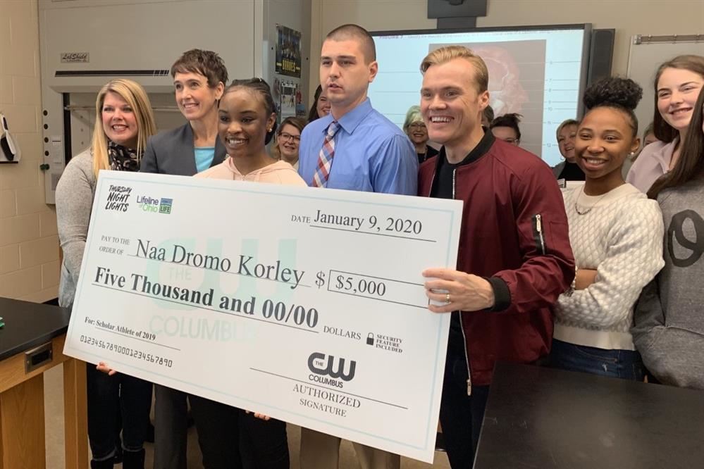 Naa Dromo Korley holding check 